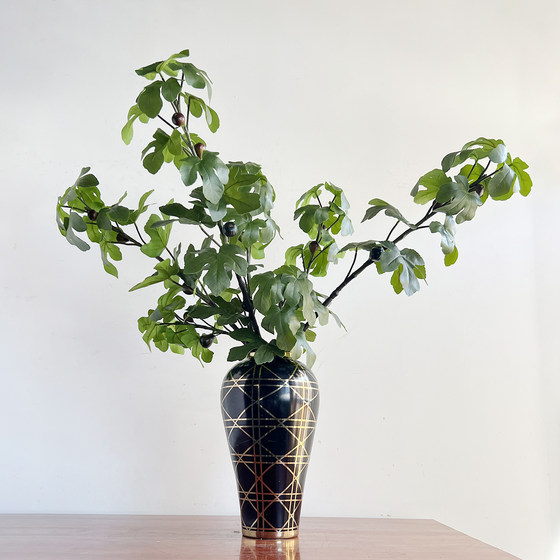 Simulated single fig branch with green plant