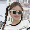 Beach vacation sunglasses make round face look smaller