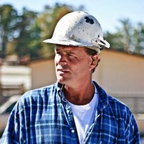 Noisy environment uses ISOtunes PRO to protect hearing active noise reduction wireless Bluetooth headphones 