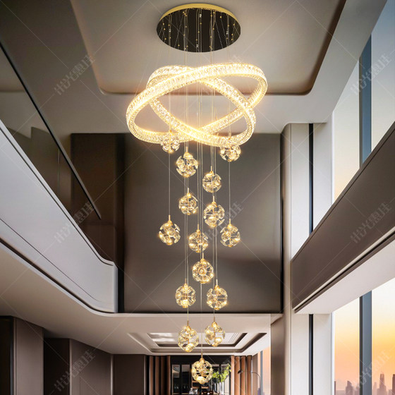 Large chandelier light luxury lamp in the living room of the duplex floor of the villa
