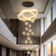 Large chandelier light luxury lamp in the living room of the duplex floor of the villa
