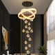 Large chandelier light luxury lamp in the living room of the duplex floor of the villa