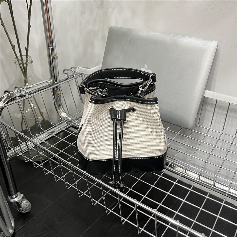 小脏柜 拼接帆布质感抽绳水桶包时尚精致撞色手提包包韩系斜挎包,淘宝优惠券,粉丝福利购,淘宝优惠卷