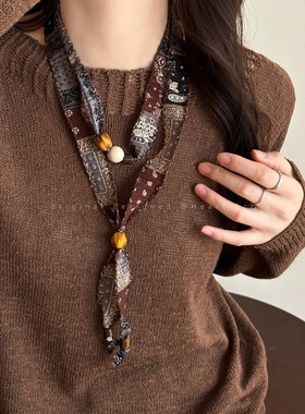 红咖腰果花圆环抽拉项链女2025秋季新款波西米亚风毛衣链百搭配饰