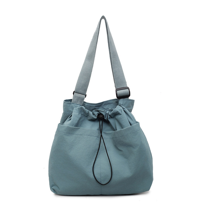 慵懒风抽绳斜挎包女尼龙布休闲运动包包轻便百搭大容量通勤单肩包,淘宝优惠券,粉丝福利购,淘宝优惠卷