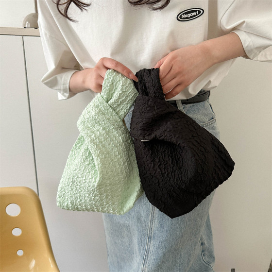 Wrist bag embossed small Japanese and Korean simple versatile wrist bag