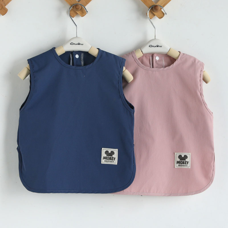 Anti-stain bib for baby wearing inside out while eating