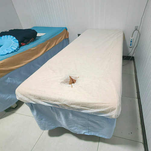 50张特价超薄一次性床罩美容院按摩床专用无纺布透气孔加厚带松紧 - 图1