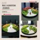 Large round table with flowers in the middle of high-end hotel dining table