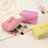Custom embroidered seersucker striped cosmetic bag
