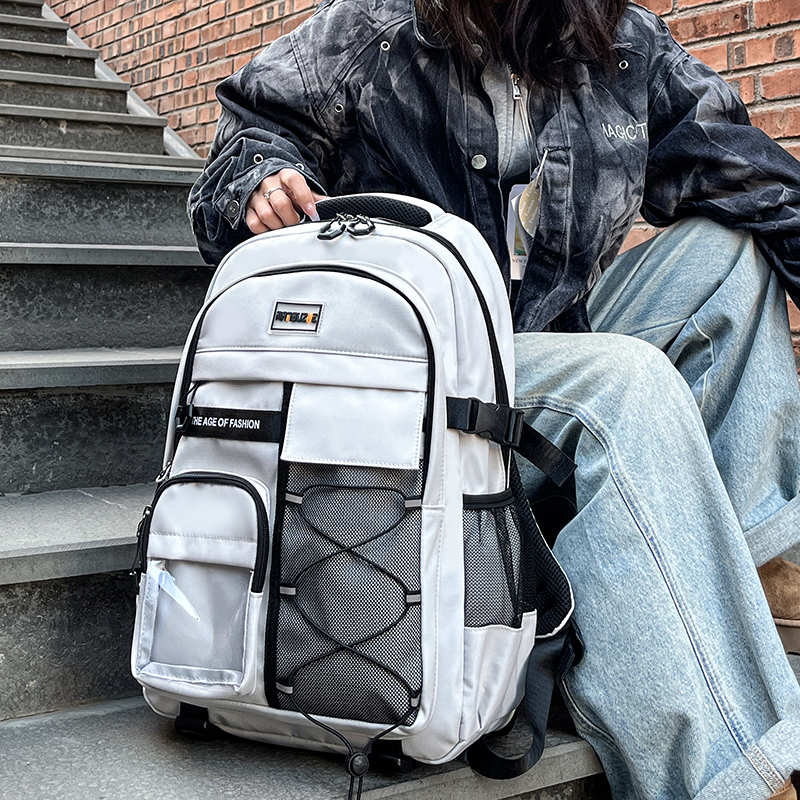 新款小学生初中生背包女减负护脊中学生书包高中男生大容量双肩包 - 图0