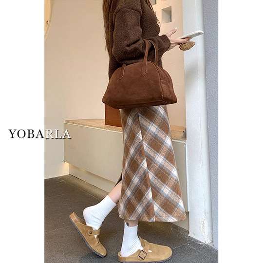 Who looks good in whoever wears it? A plaid skirt that you can wear with your eyes closed