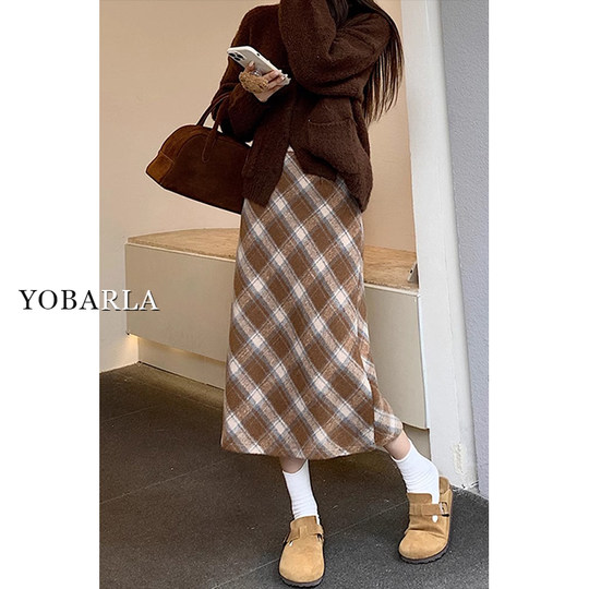 Who looks good in whoever wears it? A plaid skirt that you can wear with your eyes closed