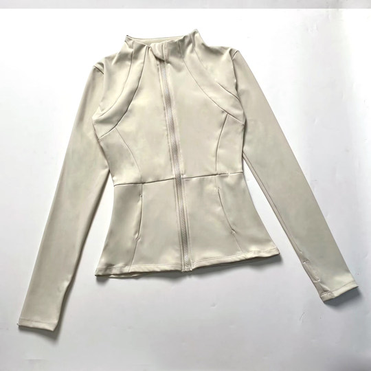 Slim-fitting sports coat with stand-up collar for women with nude look