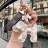 Suitable for LV ladies bag pendant new high-end leather doll bow dog keychain trinket trend