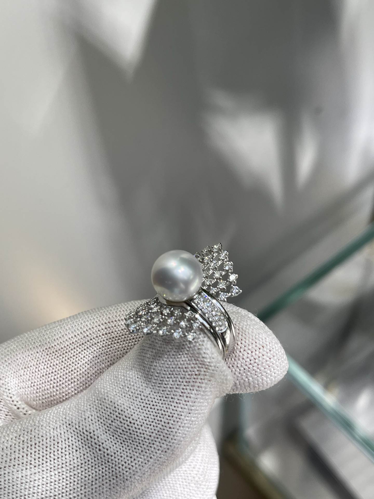 A two-wear ring that can be worn daily or for flamboyance. 10.64mm Australian white set with 18k natural diamonds. Dazzling.