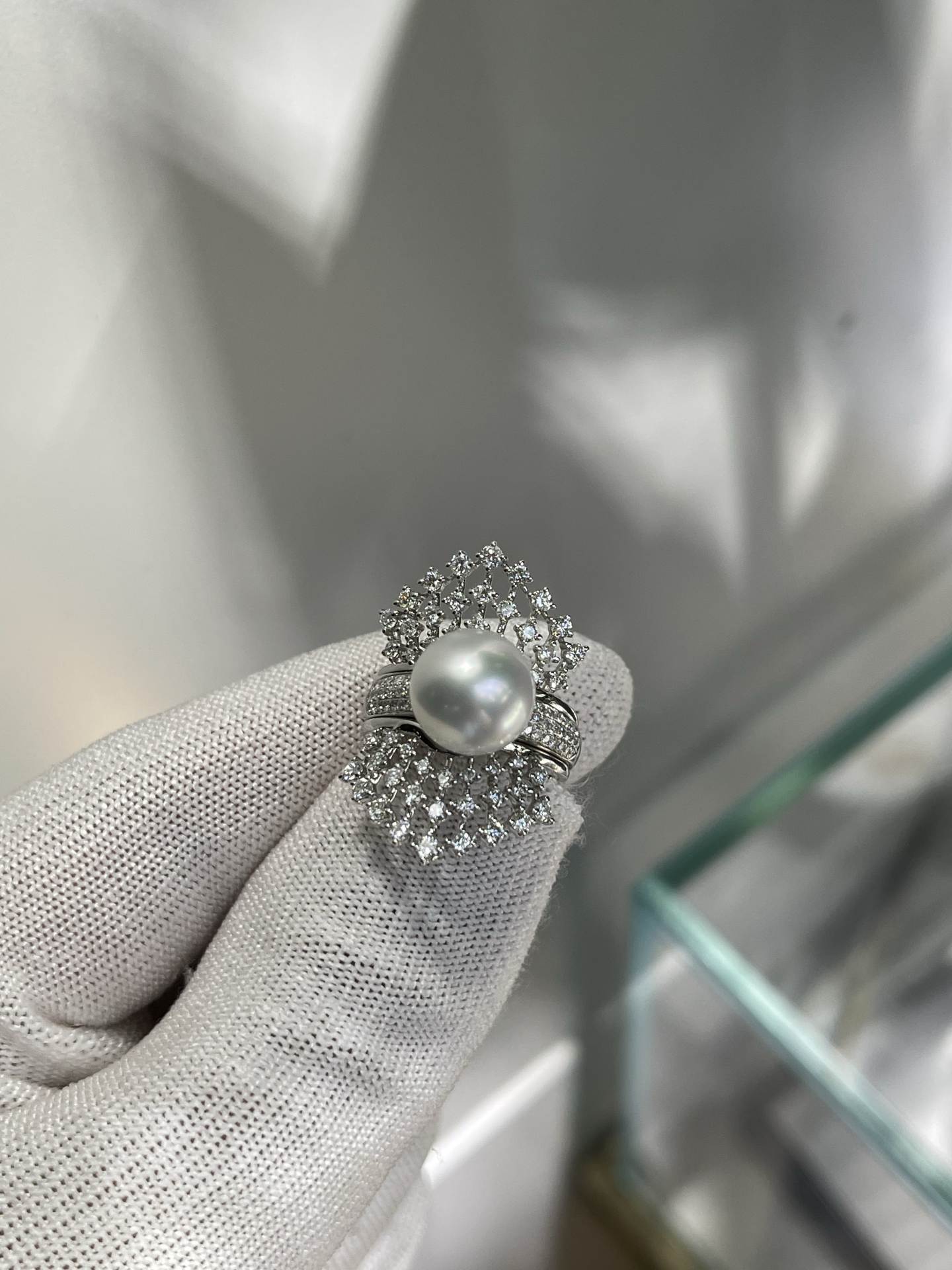 A two-wear ring that can be worn daily or for flamboyance. 10.64mm Australian white set with 18k natural diamonds. Dazzling.