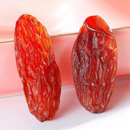 Xinjiang auténtico Hongxiangfei pasas de grano grande snacks snacks frutas secas pasas sin semillas al por mayor