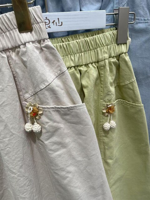 Japanese college style solid color elastic waist A-line pocket skirt for women. High-waisted, slim, sweet, simple and versatile skirt