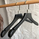 Good-looking and practical black solid wood clothes hanger