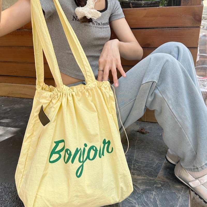 2025夏季新抽绳帆布包ins日系托特包上班通勤手提袋大容量单肩包,淘宝优惠券,粉丝福利购,淘宝优惠卷