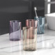 Toothbrush rack with built-in toothpaste dispenser and mouthwash cup
