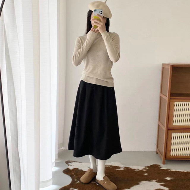Crotch-covering A-line skirt for petites with pressed pleats and drapey umbrella skirt