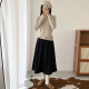 Crotch-covering A-line skirt for petites with pressed pleats and drapey umbrella skirt