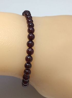 咖啡色编织可调节长度石榴石手串