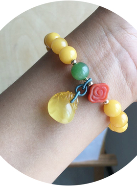 满蜜鸡油黄设计款钱袋单圈手链