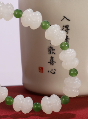 新疆和田玉并蒂莲花手串11x10mm