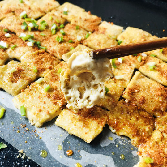 Hand-shredded tofu comes with dipping sauce and small tofu wrapped in milk