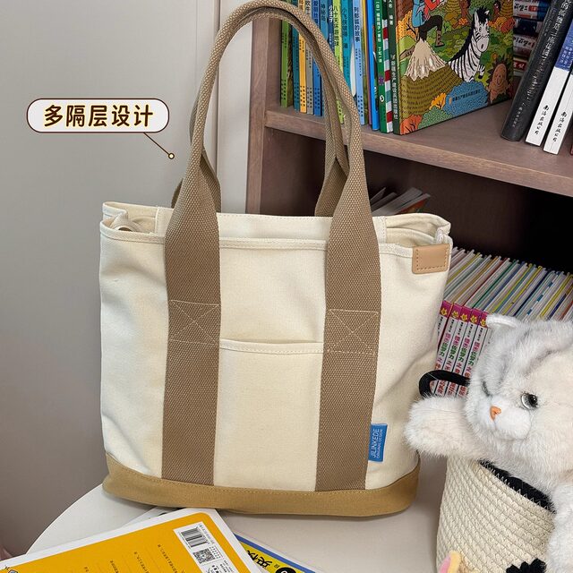 A multi-component canvas shoulder bag was snatched hard
