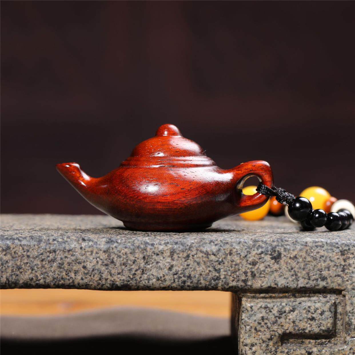 Hand-carved teapot made of rosewood