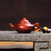 Hand-carved teapot made of rosewood