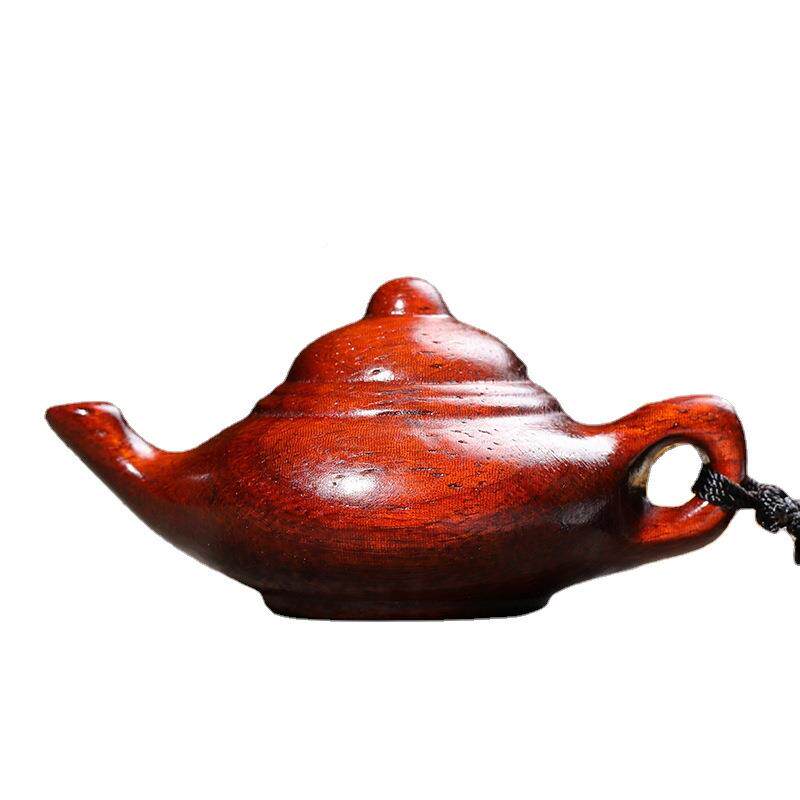 Hand-carved teapot made of rosewood