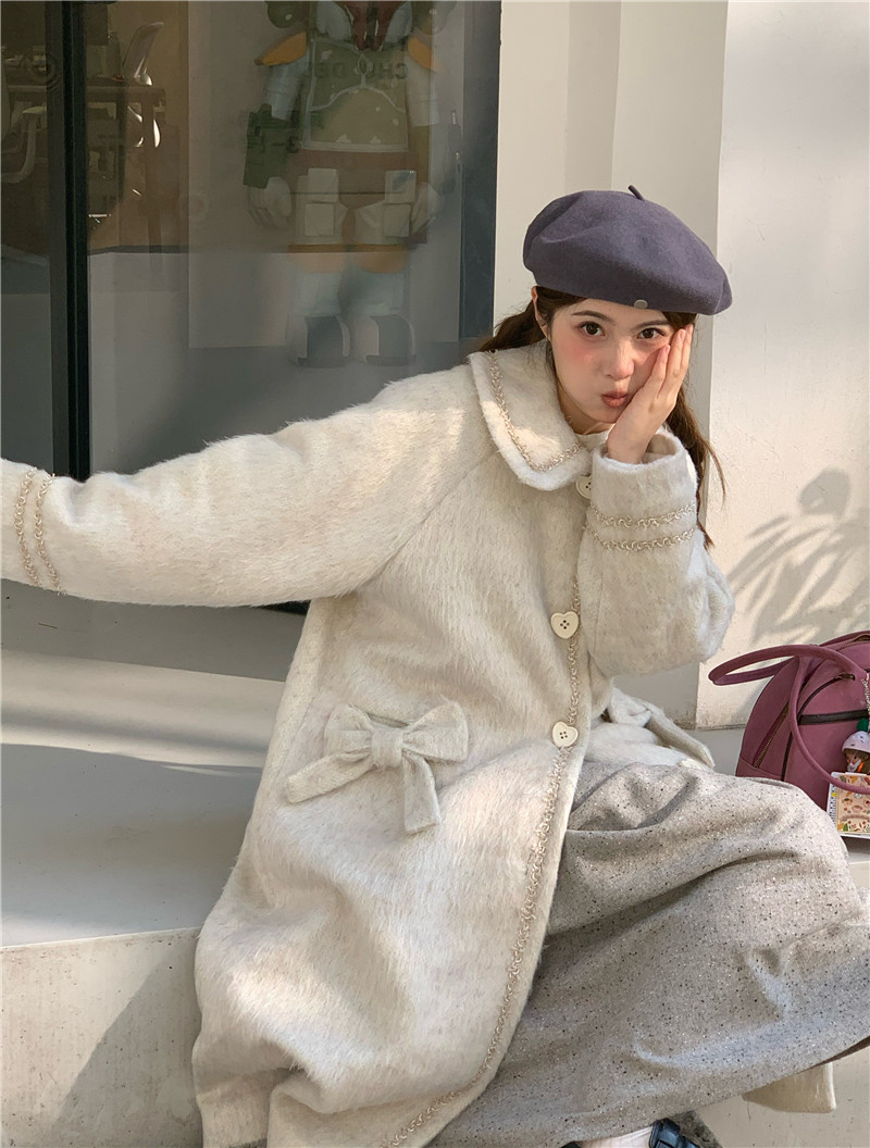 蛋包饭餐厅 米白色爱心扣中长款大衣 10.31 新品95折上架,淘宝优惠券,粉丝福利购,淘宝优惠卷