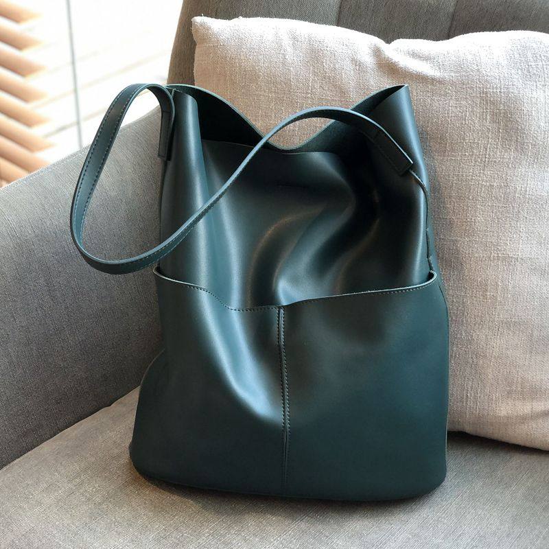 菲色如华新款气质牛皮女休闲水桶包 菲色如华女士包袋