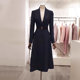 Mid-length, elegant, wide-slung, waist-cinched woolen coat