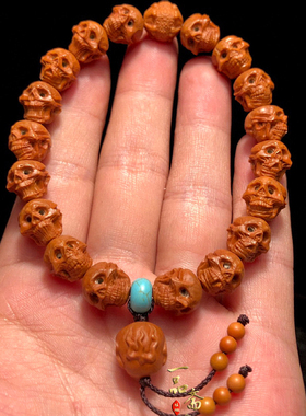 精雕骷髅头龙纹桃核手串