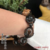 Fidelity Hailiu Wen playing Buddhist beads bracelet