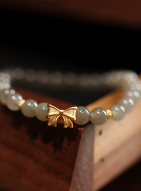 天然6MM和田玉手链女烟紫S925银镀金蝴蝶结单圈手链