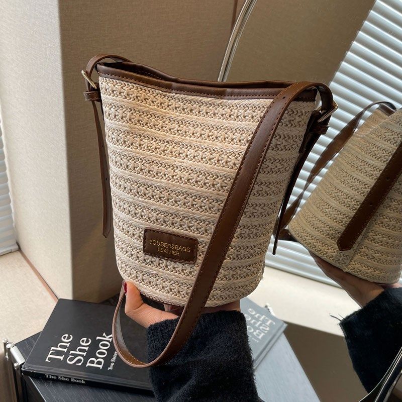 夏天编织草编包包女2025新款海边度假沙滩包百搭小众斜挎包水桶包,淘宝优惠券,粉丝福利购,淘宝优惠卷