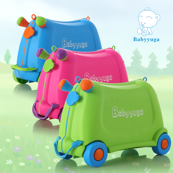 kids sit on luggage