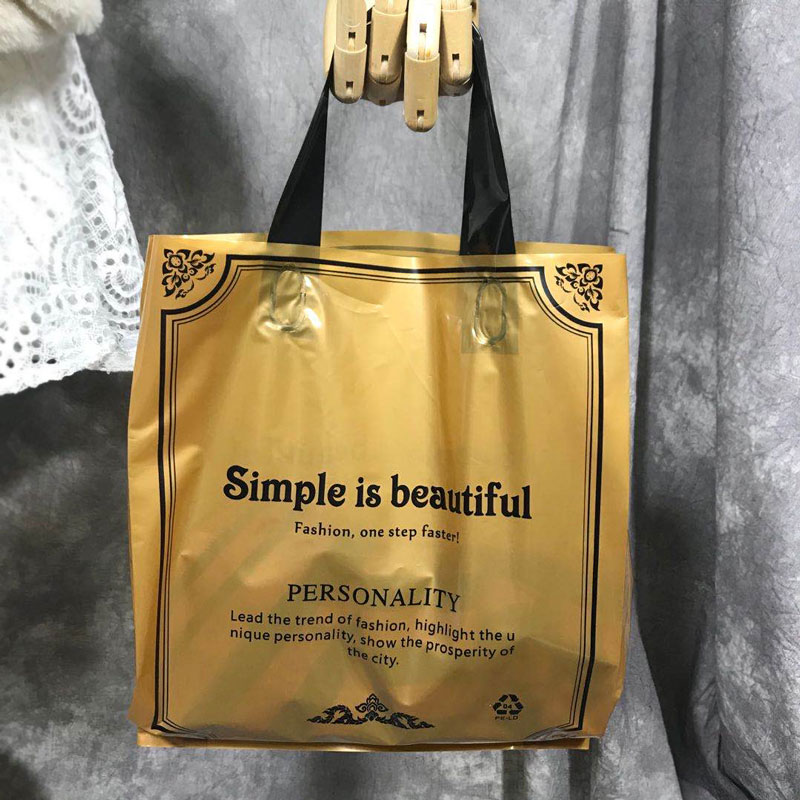 男装服装店手挽塑料袋女装衣服袋好看黑色购物手提袋鞋店白色
