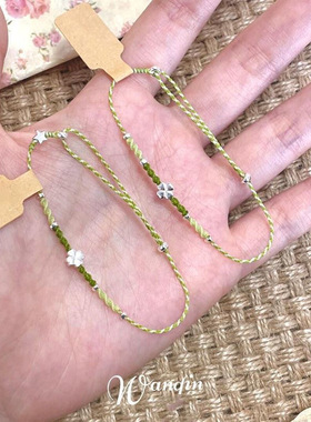 小红书爆款绿色四叶草小蝶蜡线编织手链女时尚显白设计百搭奢品一