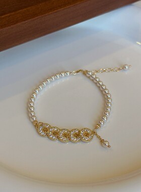 深圳旭佳旭家来财来财~正圆施家珍珠拼接闪钻五帝钱手链女轻奢风