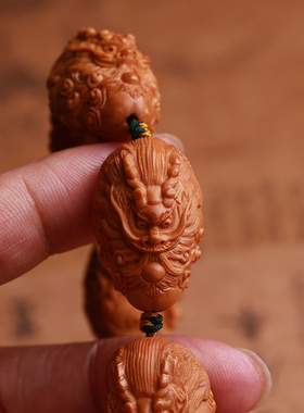 橄榄核雕刻手工民族风九龙戏珠