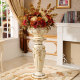Roman column floor-standing vase ceramic next to TV cabinet in living room