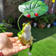 Hold an umbrella to enjoy the cool, simulated frog ornament